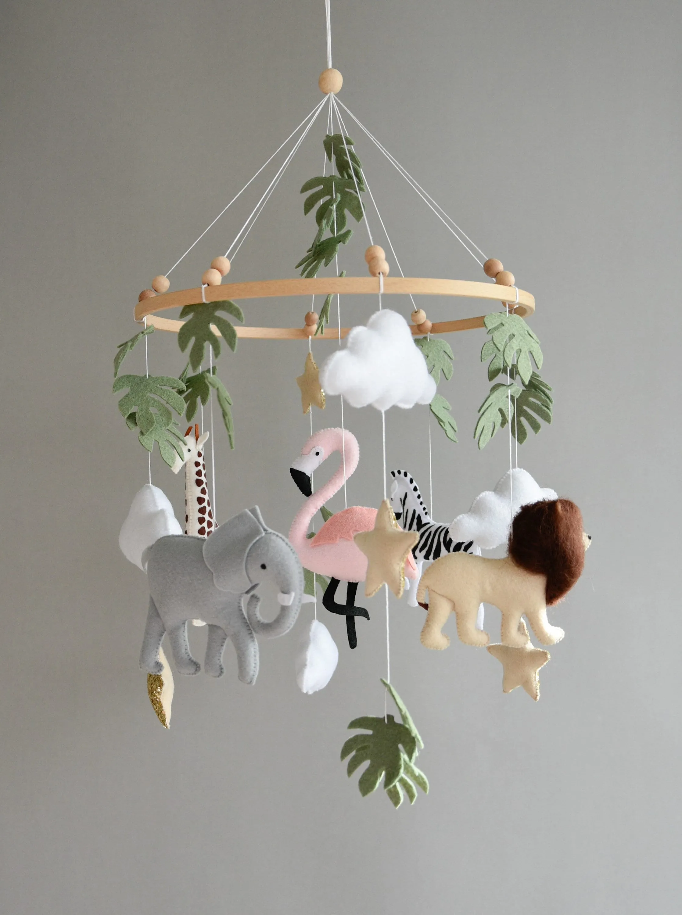 Safari  mobile with lion, zebra,, flamingos, elephants, monstera leaves, stars and clouds