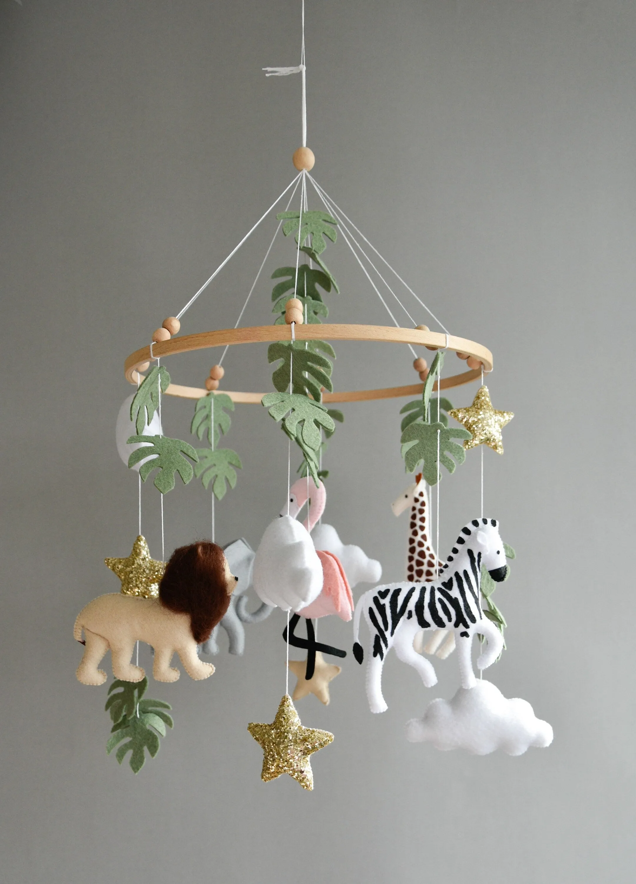 Safari  mobile with lion, zebra,, flamingos, elephants, monstera leaves, stars and clouds